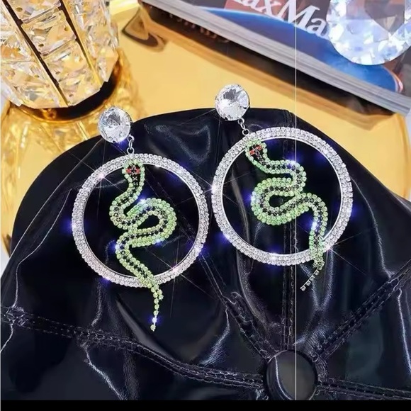 These are glamorous snake-themed hoop earrings with rhinestones. - Picture 3 of 3